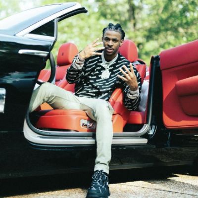 Picture of Jamie Morant son, Ja Morant sitting in a black car.